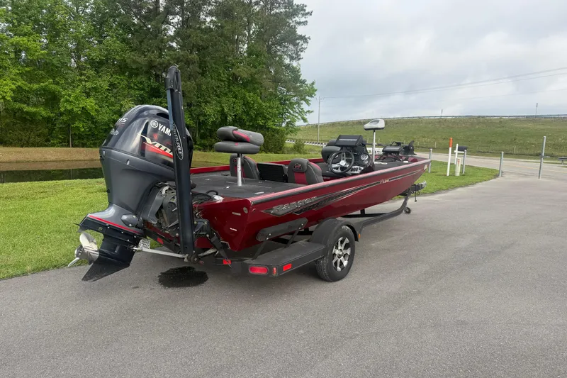 Slide: The Image of 2019 Ranger RT188 boat with Yamaha motor on a trailer, parked outdoors. - 5