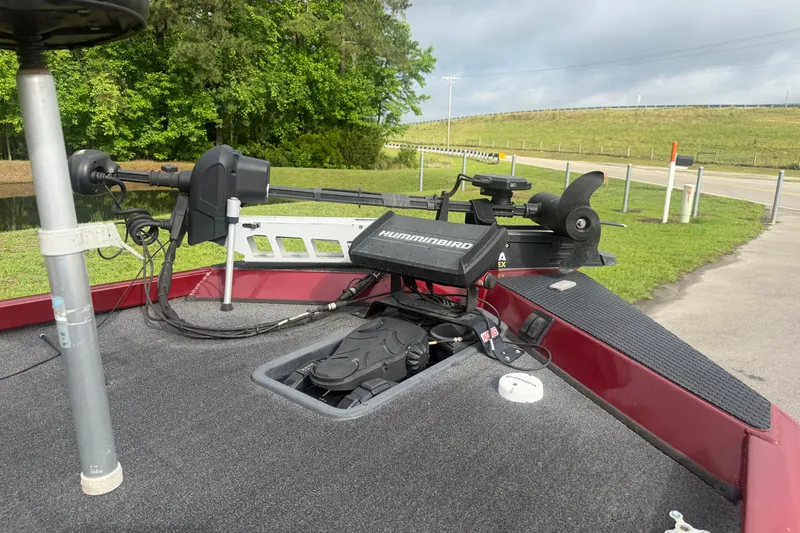 Slide: The Image of 2019 Ranger RT188 boat with Humminbird electronics, parked near a grassy area. - 8