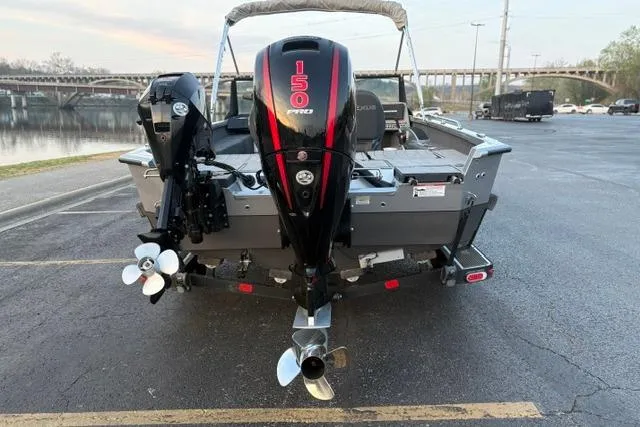Slide: The Image of 2023 Vexus ADX 190 boat with powerful 150 Pro motor, parked near a waterfront. - 10