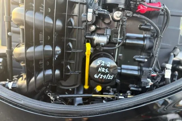 Slide: The Image of Close-up of Vexus ADX 190 engine, showing detailed components and maintenance markings. - 12