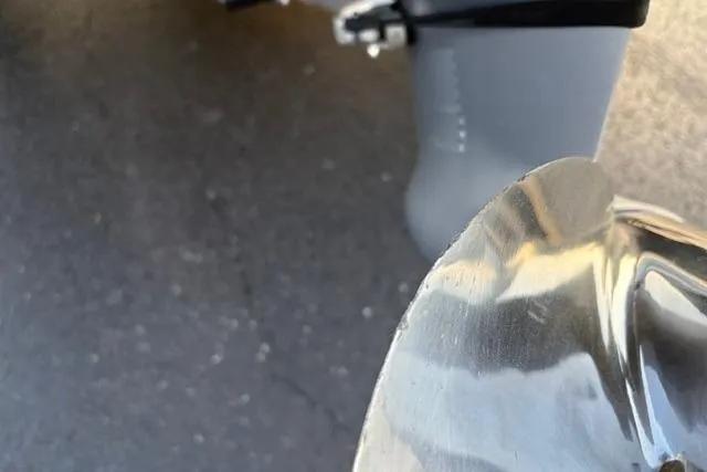 Slide: The Image of Close-up of a 2023 Vexus ADX 190 boat propeller on pavement. - 17