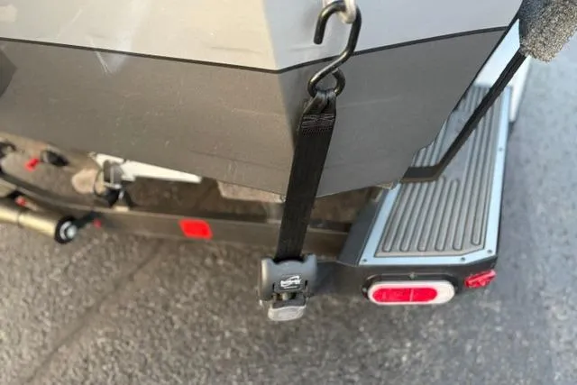 Slide: The Image of 2023 Vexus ADX 190 boat trailer with secure strap and rear light. - 22