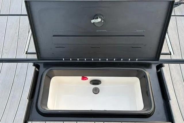 Slide: The Image of Open storage compartment on 2023 Vexus ADX 190 boat deck. - 29