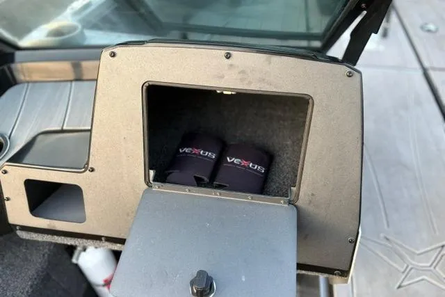 Slide: The Image of 2023 Vexus ADX 190 boat storage compartment with branded accessories. - 32