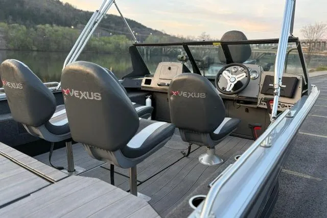 Slide: The Image of 2023 Vexus ADX 190 boat interior with steering wheel and branded seats. - 44
