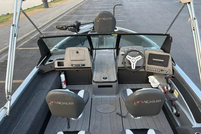 Slide: The Image of 2023 Vexus ADX 190 boat interior with steering console, seating, and modern navigation equipment. - 45