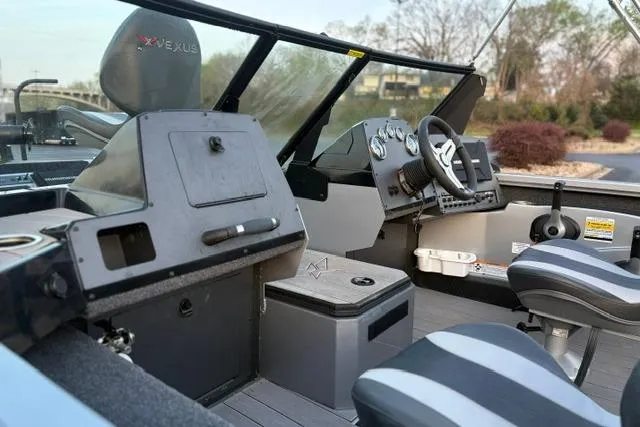 Slide: The Image of 2023 Vexus ADX 190 boat interior with steering wheel and seating. - 49