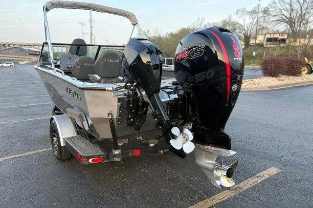 Slide: The Image of 2023 Vexus ADX 190 boat with powerful engine, parked in a lot. - 9