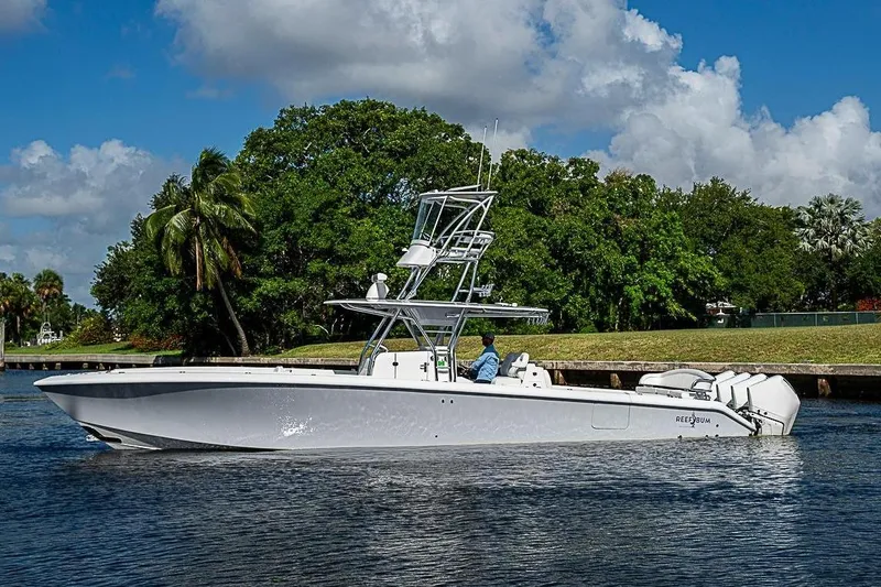 The Image of Bahama 41 boat 2022 on calm water with lush greenery backdrop. - 0