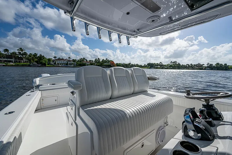 Slide: The Image of Luxurious 2022 Bahama 41 boat interior with plush seating and scenic waterfront view. - 13