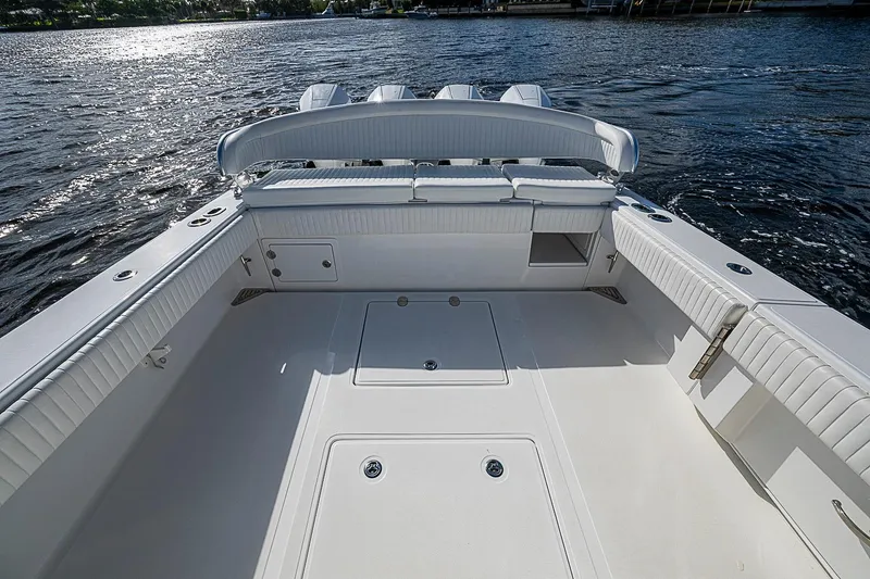 Slide: The Image of Spacious deck of 2022 Bahama 41 boat with sleek seating and storage compartments. - 23