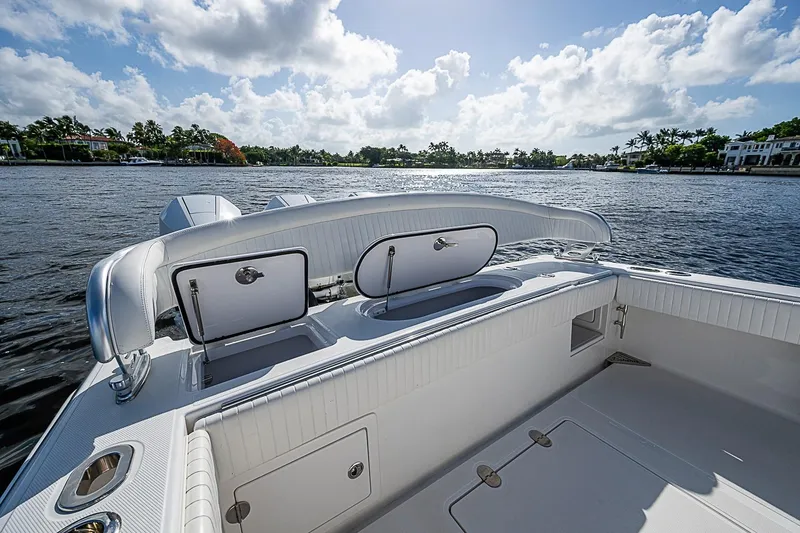 Slide: The Image of 2022 Bahama 41 boat interior with open storage compartments on a sunny day. - 28