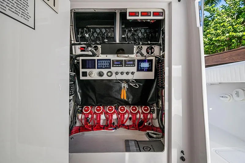 Slide: The Image of Electrical panel of a 2022 Bahama 41 boat, showcasing wiring and controls. - 31