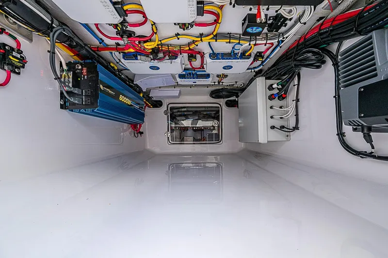 Slide: The Image of Electrical system setup in a 2022 Bahama 41 boat, featuring wiring and components. - 32