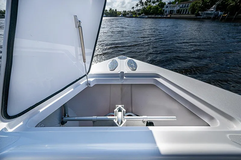 Slide: The Image of Open storage compartment on 2022 Bahama 41 boat, with scenic water view. - 6