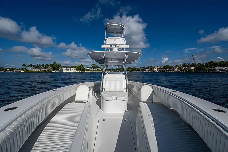 Slide: The Image of 2022 Bahama 41 boat on water, featuring sleek design and spacious seating. - 7