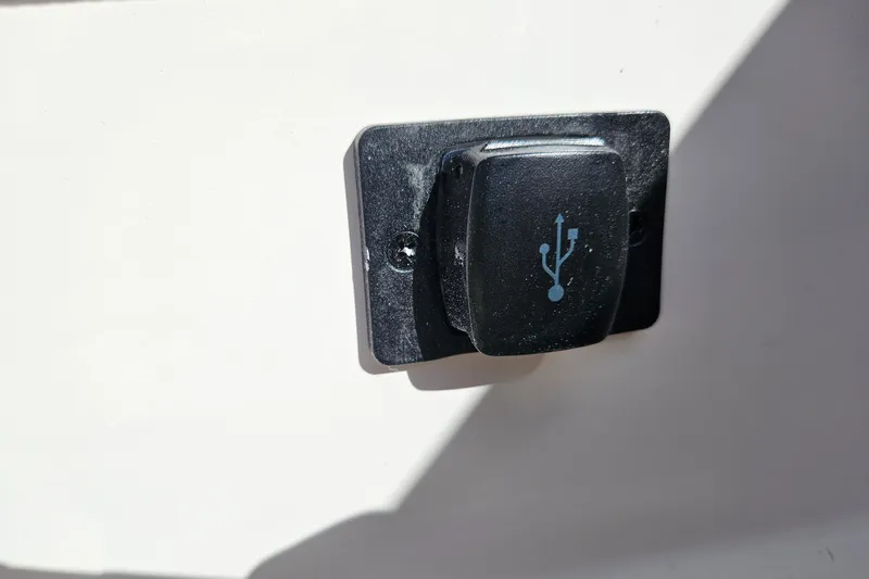 Slide: The Image of USB port on 2026 Bayliner V20 boat, mounted on a white surface. - 17