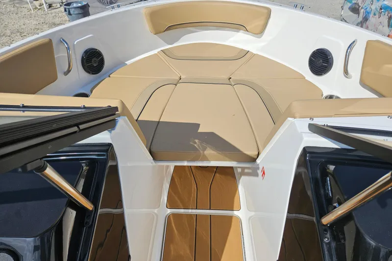 Slide: The Image of 2026 Bayliner V20 boat interior with tan seating and modern design. - 19