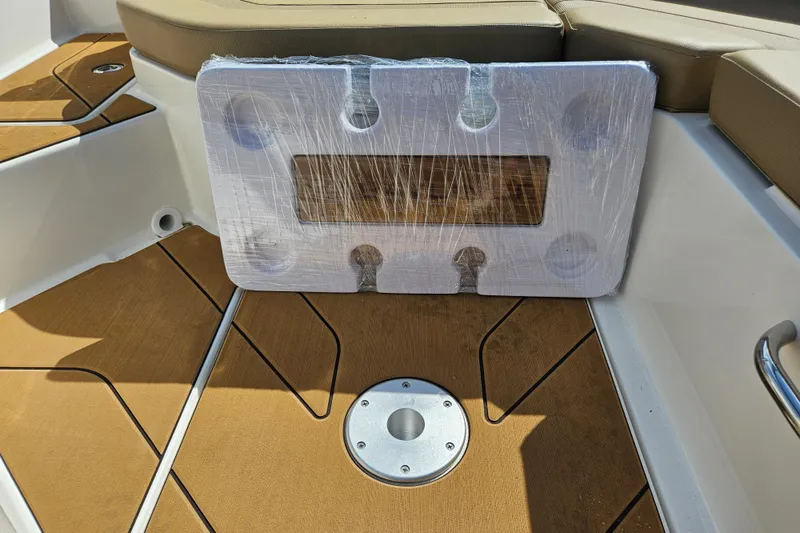 Slide: The Image of Interior of 2026 Bayliner V20 boat with wrapped accessory on deck. - 23