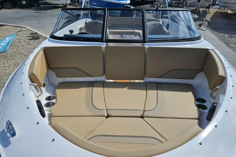 Slide: The Image of 2026 Bayliner V20 boat interior with beige seating and cup holders. - 26