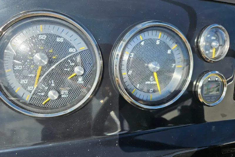 Slide: The Image of Dashboard of a 2026 Bayliner V20 boat with speedometer and tachometer gauges. - 6