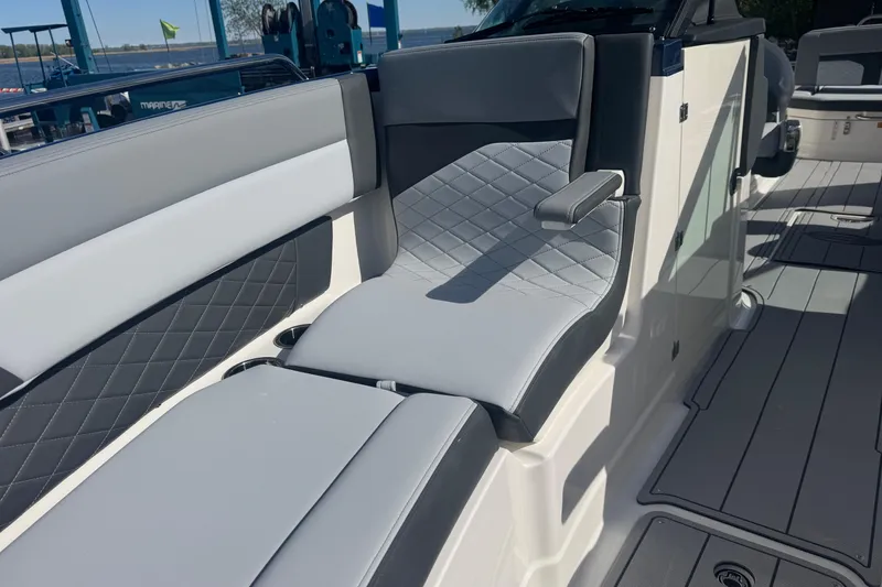 Slide: The Image of 2026 Chaparral SSX 30 boat interior with luxurious gray seating and diamond stitching. - 10