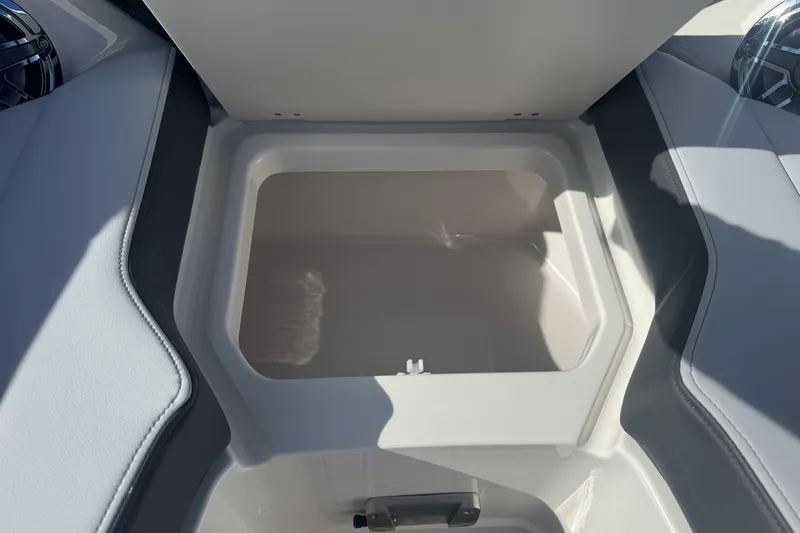 Slide: The Image of Open storage compartment on 2026 Chaparral SSX 30 boat, showcasing interior space. - 12