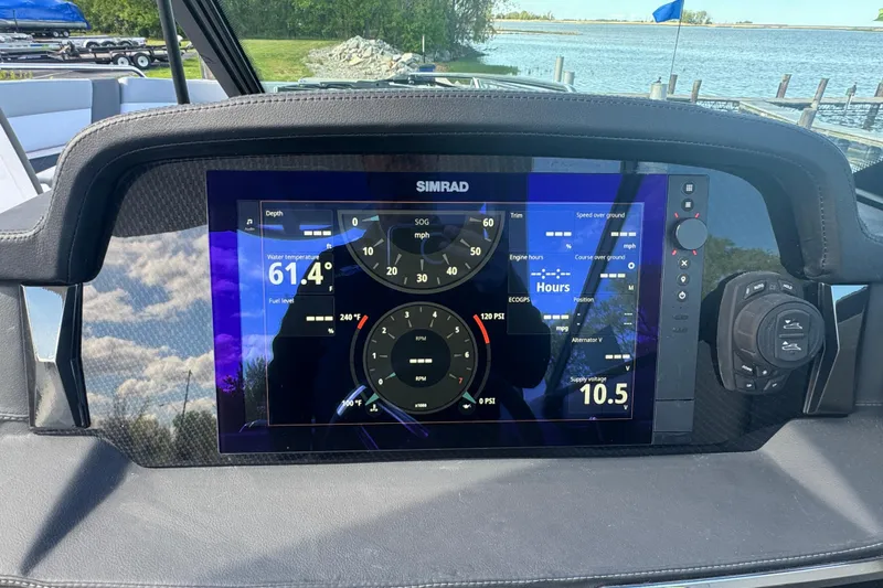 Slide: The Image of Dashboard of 2026 Chaparral SSX 30 boat with Simrad display showing navigation data. - 16