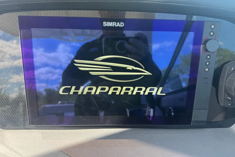 Slide: The Image of Simrad display showing Chaparral logo on 2026 SSX 30 boat dashboard. - 18
