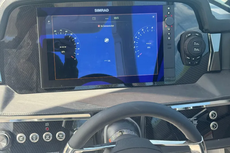 Slide: The Image of Dashboard of 2026 Chaparral SSX 30 boat with Simrad display and controls. - 20