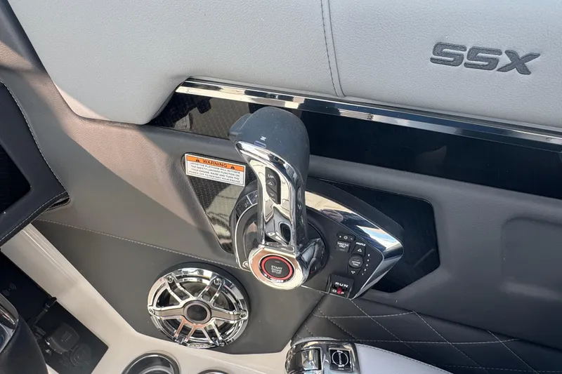 Slide: The Image of 2026 Chaparral SSX 30 boat throttle control panel with sleek design and modern features. - 23