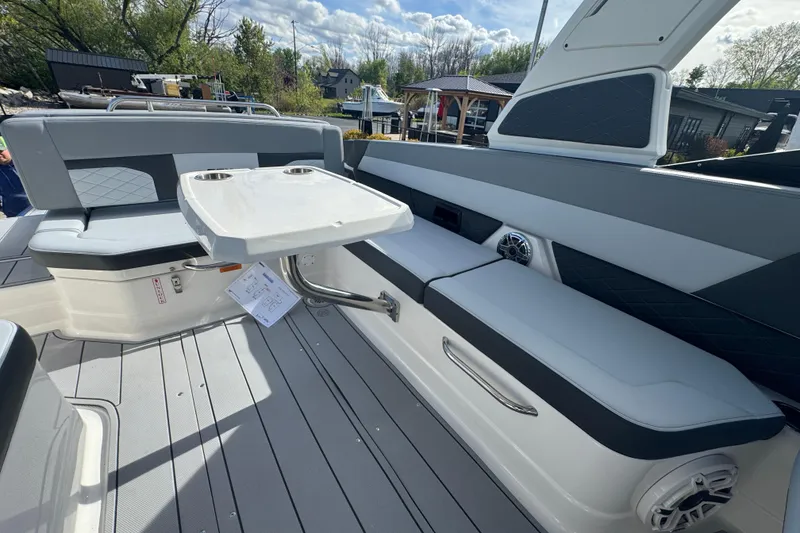 Slide: The Image of 2026 Chaparral SSX 30 boat interior with seating and table, showcasing modern design. - 3