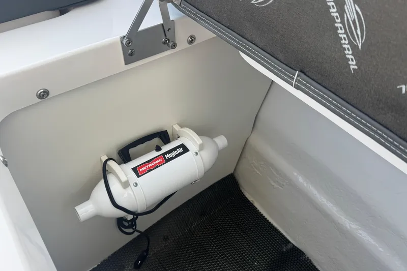 Slide: The Image of 2026 Chaparral SSX 30 boat interior with Metrovac MagicAir inflator mounted on white panel. - 30