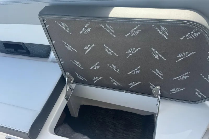 Slide: The Image of 2026 Chaparral SSX 30 boat storage compartment with branded interior lining. - 33