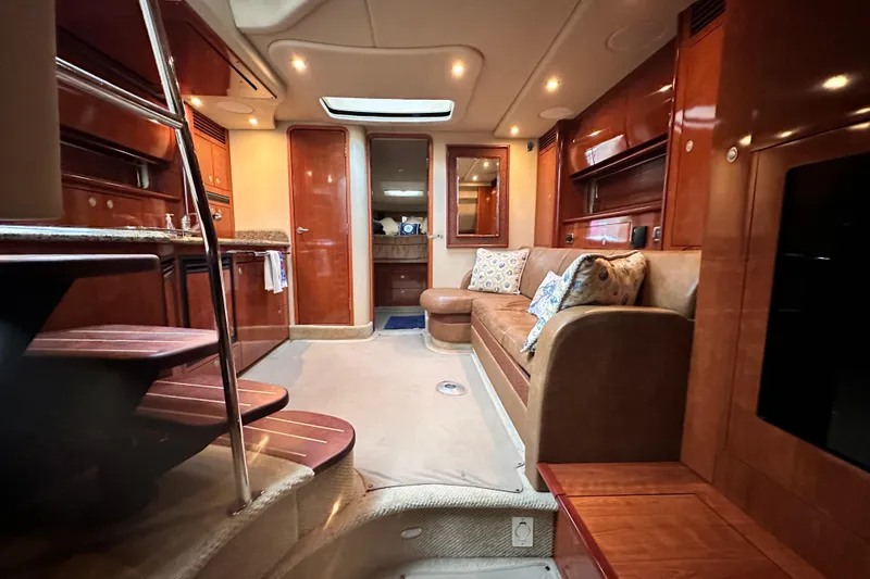 Slide: The Image of Luxurious interior of 2005 Sea Ray 390 Sundancer yacht with plush seating and elegant wood finishes. - 11