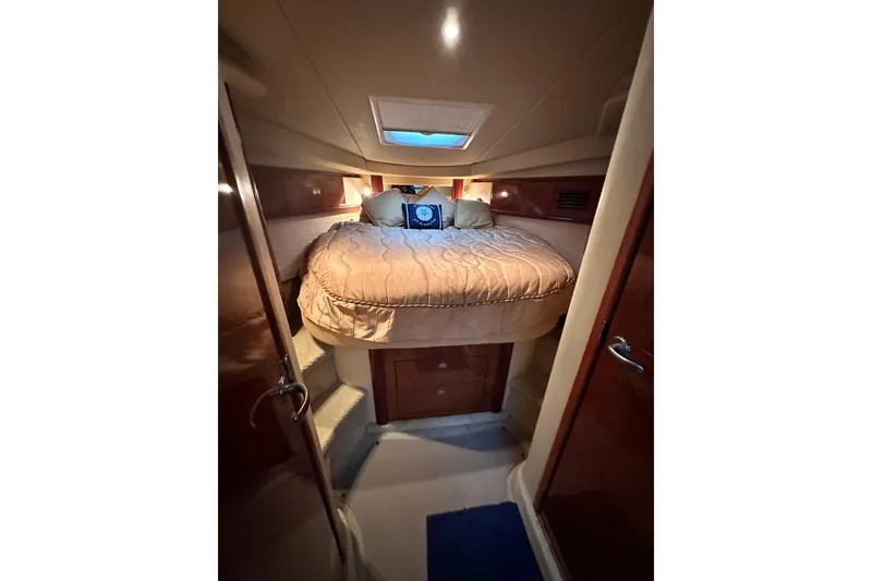 Slide: The Image of Luxurious cabin interior of 2005 Sea Ray 390 Sundancer yacht with cozy bedding. - 12