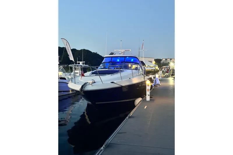 Slide: The Image of 2005 Sea Ray 390 Sundancer yacht docked at marina during evening. - 3