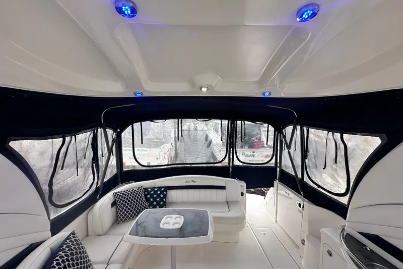 Slide: The Image of Interior of 2005 Sea Ray 390 Sundancer yacht with seating and blue LED lights. - 8