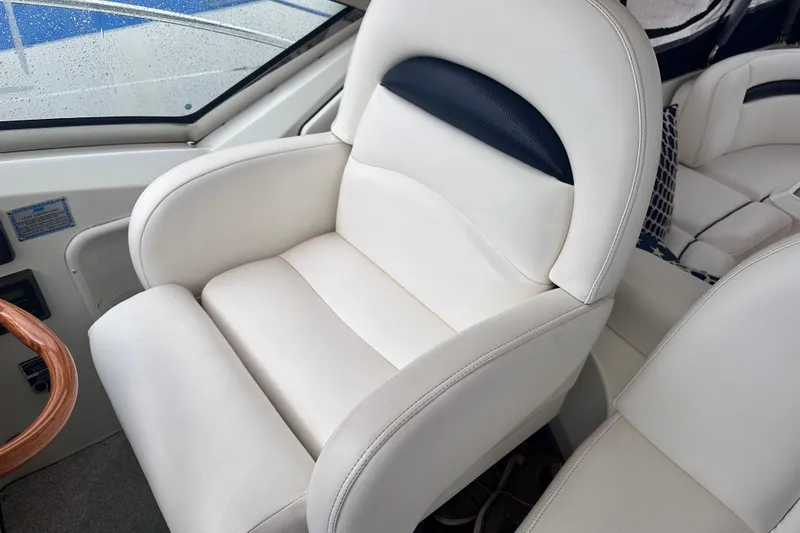 Slide: The Image of Luxurious white leather seat on 2005 Sea Ray 390 Sundancer boat. - 9