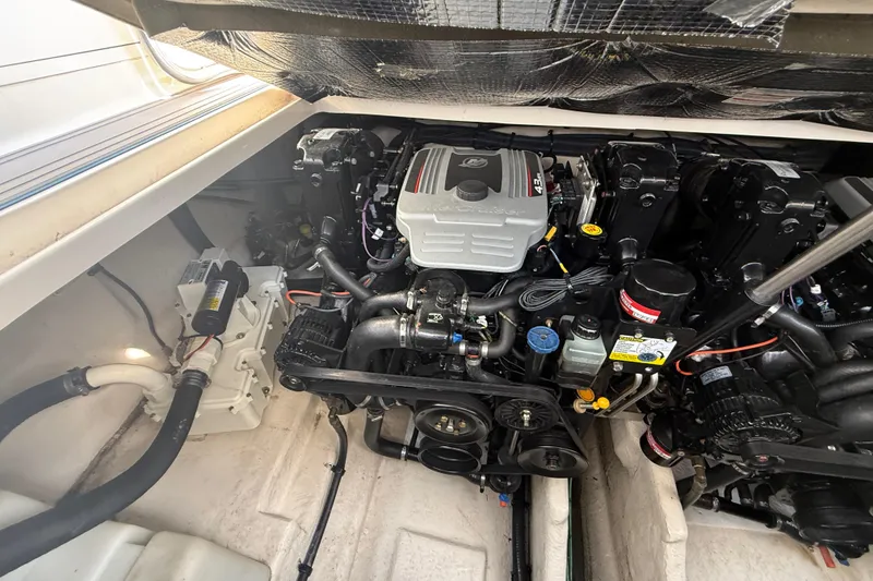 Slide: The Image of Engine compartment of a 2009 Sea Ray Sundancer 280 boat, showcasing detailed mechanical components. - 7