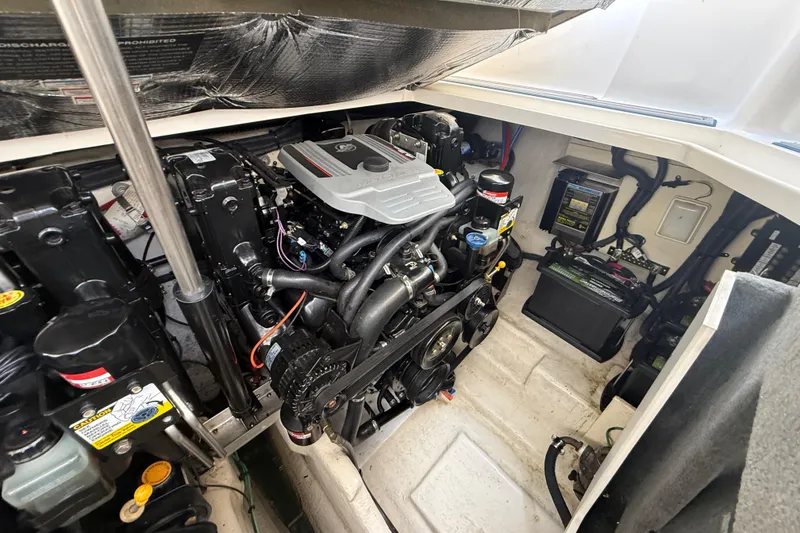 Slide: The Image of Engine compartment of a 2009 Sea Ray Sundancer 280 boat, showcasing mechanical components. - 8
