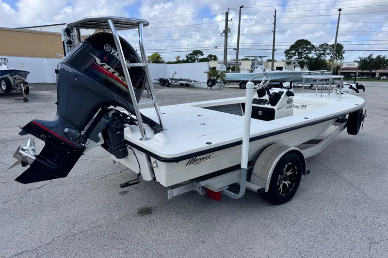 Slide: The Image of 2022 Maverick 18 HPX-V boat with Yamaha outboard motor on trailer in parking lot. - 12