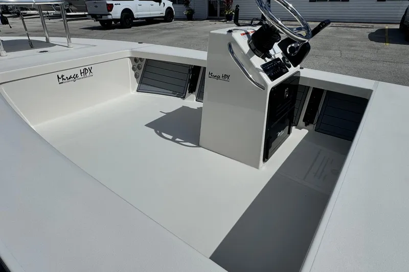 Slide: The Image of 2022 Maverick 18 HPX-V boat interior with steering console and storage compartments. - 16
