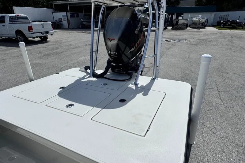 Slide: The Image of 2022 Maverick 18 HPX-V boat with Yamaha 115 engine in a parking lot. - 17