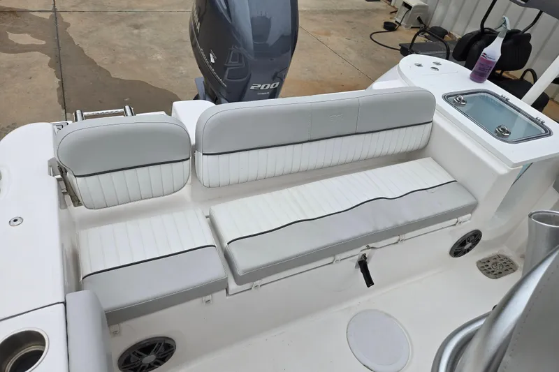 Slide: The Image of 2023 Sea Fox 228 Commander boat interior with seating and Yamaha 200 engine. - 10
