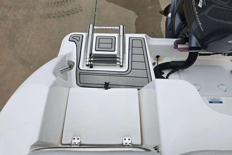 Slide: The Image of 2023 Sea Fox 228 Commander boat stern with ladder and engine detail. - 11