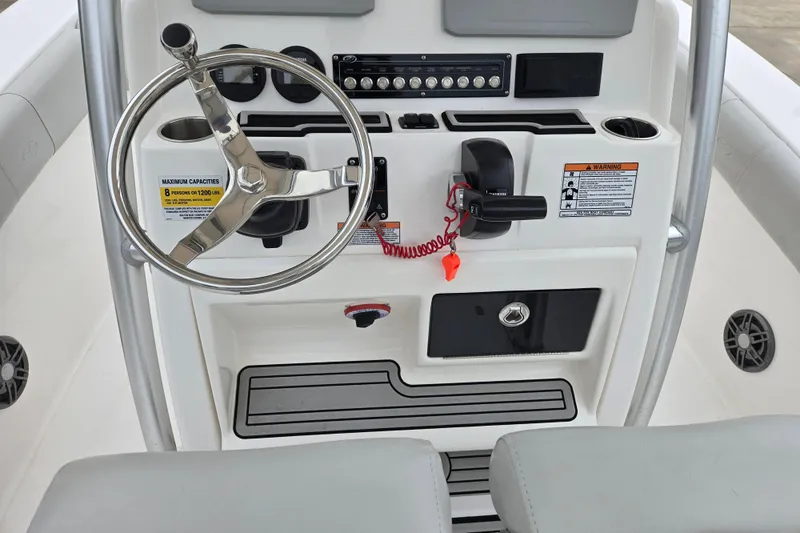 Slide: The Image of 2023 Sea Fox 228 Commander boat console with steering wheel and controls. - 14