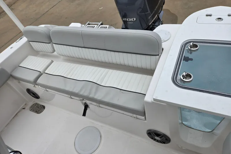 Slide: The Image of 2023 Sea Fox 228 Commander boat interior with seating and engine view. - 21
