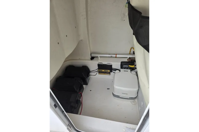 Slide: The Image of Interior view of 2023 Sea Fox 228 Commander boat's storage compartment with equipment. - 4