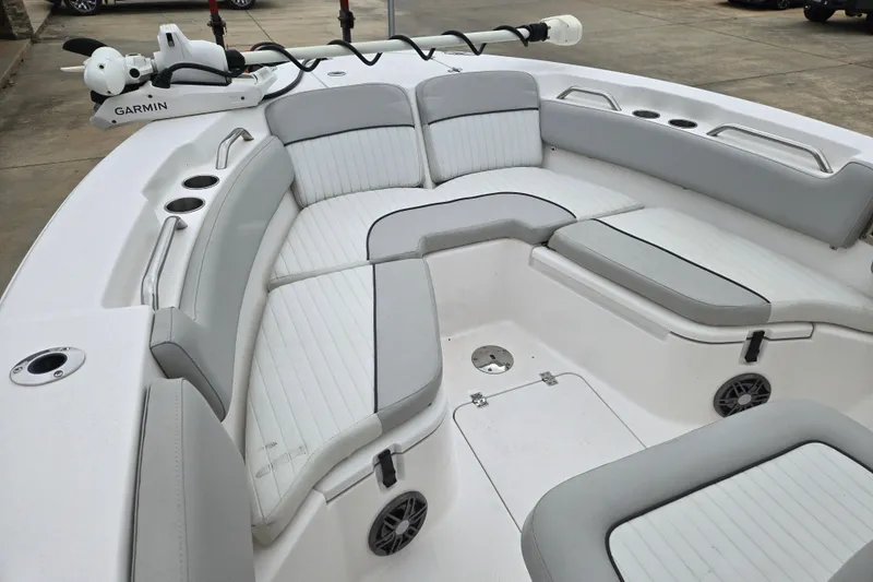 Slide: The Image of 2023 Sea Fox 228 Commander boat interior with cushioned seating and Garmin equipment. - 5
